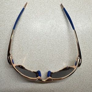 Polarized Sunglasses with blue lenses and ear cushions. Peach metal frames, New